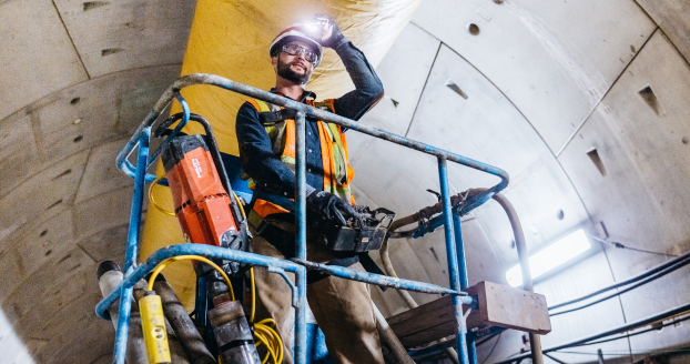 WJ Middle East News: Worker operating machinery in tunnel