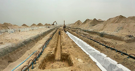 Construction site with trenches and machinery