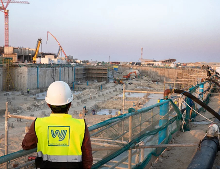 Comprehensive Dewatering Solutions - Engineer overlooking big construction site